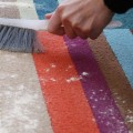 How do you clean rugs at home?